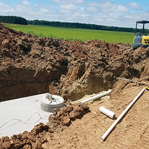 Professionals Installing a Septic Tank